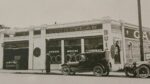 Historic Speck Buick Company dealership with vintage cars parked outside